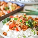 Sheet pan cashew chicken served on a plate with rice.