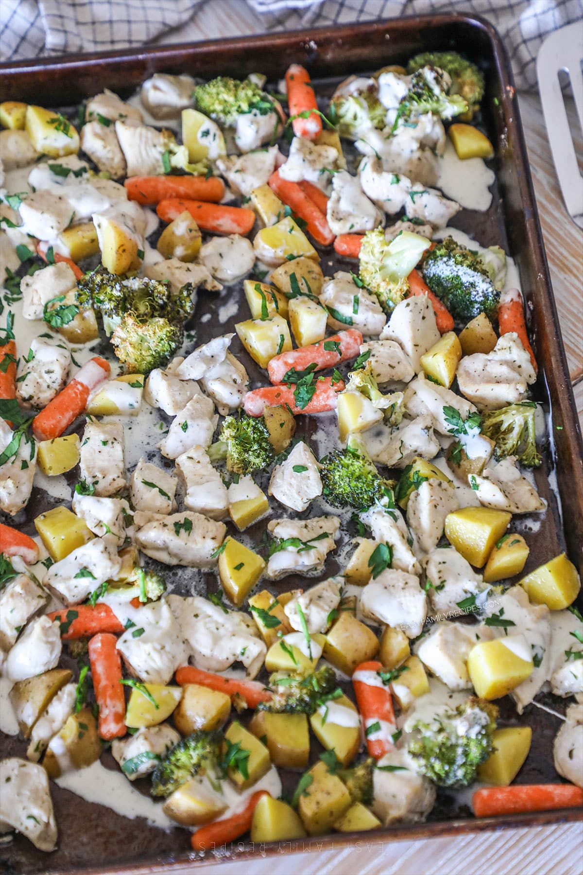above image of ranch sheet pan chicken and veggies.
