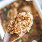 above image of a scoop of stick of butter rice on a wooden spoon.