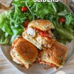 Overhead shot of 3 ready to eat Parmesan Chicken Sliders on a white plate