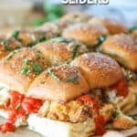 Finished Parmesan Chicken Sliders with marinara dripping out