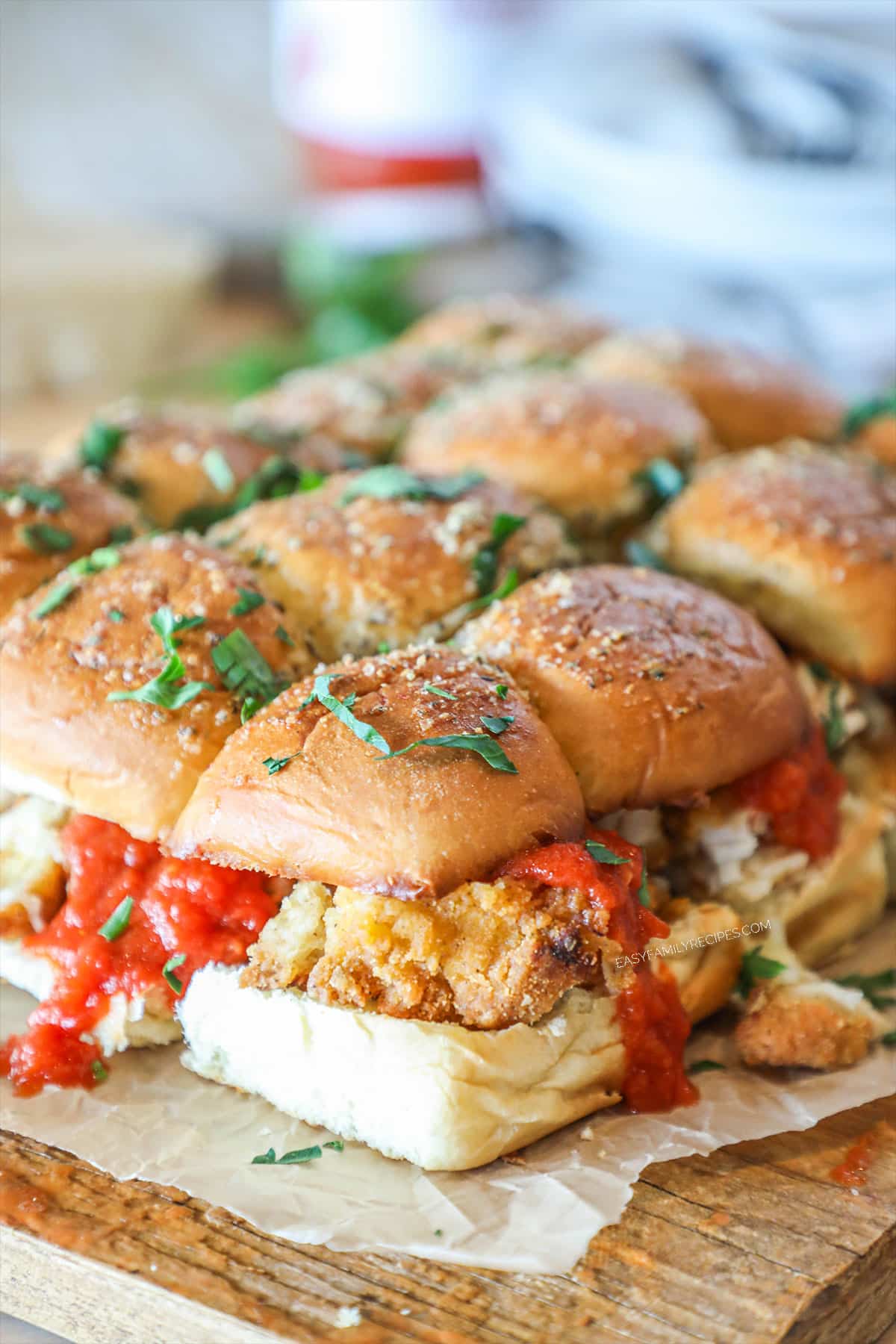 chicken parmesan sliders that are oozing marinara and ready to eat