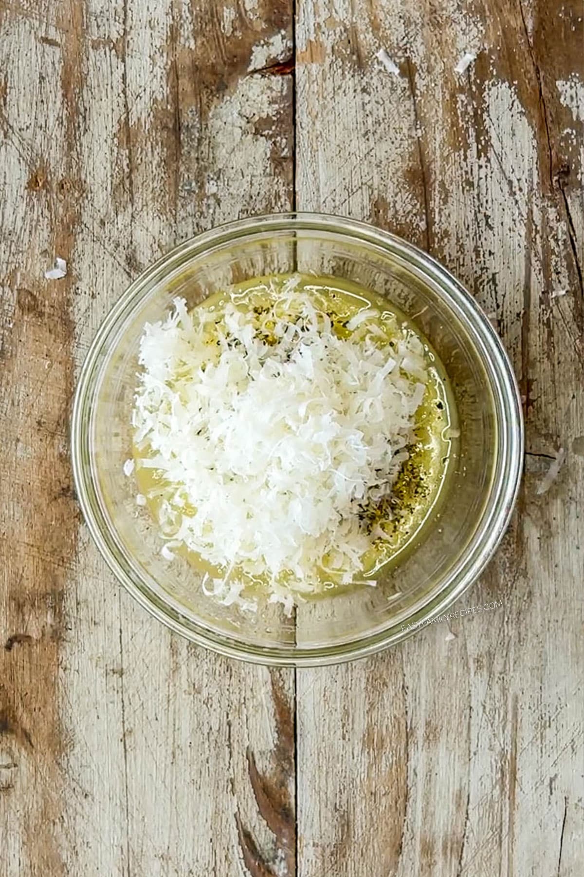 MIcrowave butter to melt, then add the Italian seasoning, garlic powder or garlic salt, and parmesan cheese.