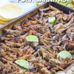 Crockpot Pork Carnitas recipe prepared and spread on a sheet pan to crisp.