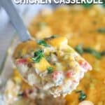 Serving spoon with a portion of king ranch chicken casserole on it.