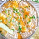 above image of buffalo chicken dip in a serving dish.