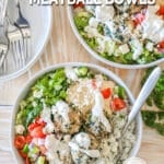 Overhead shot of two Mediterranean meatball bowls on a wooden background.