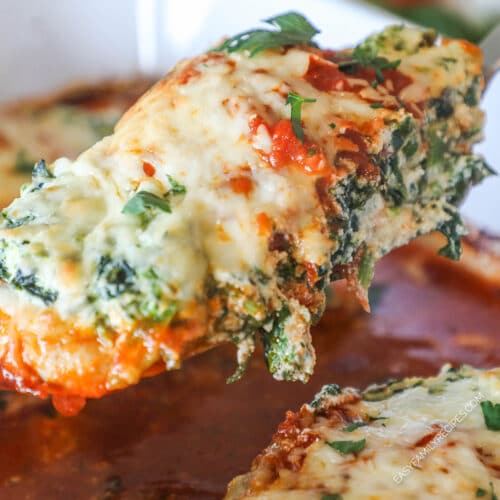 Close up of spinach ricotta chicken on a spatula.
