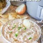 a shallow dish of onion dip sitting next to a slow cooker.