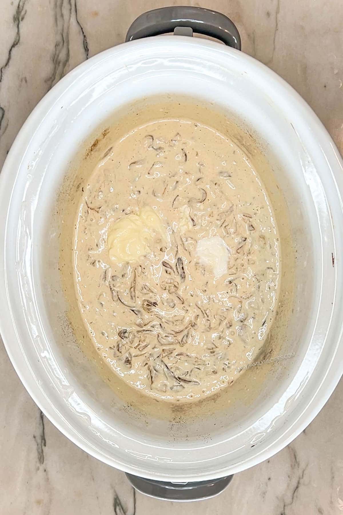 creamy onion dip in a crockpot.