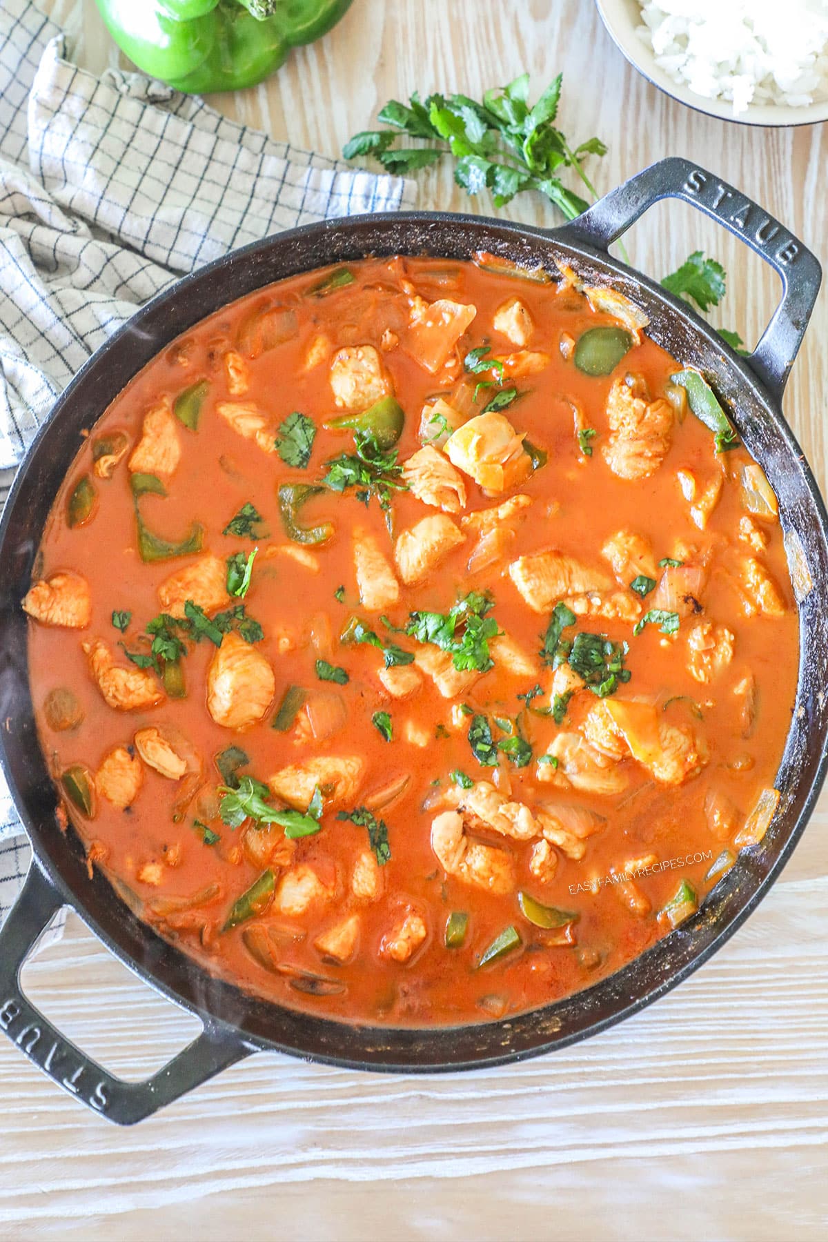 Overhead shot of one pan chicken curry in a skillet.