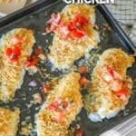Panko cheddar chicken on a sheet pan with pico de gallo on top.