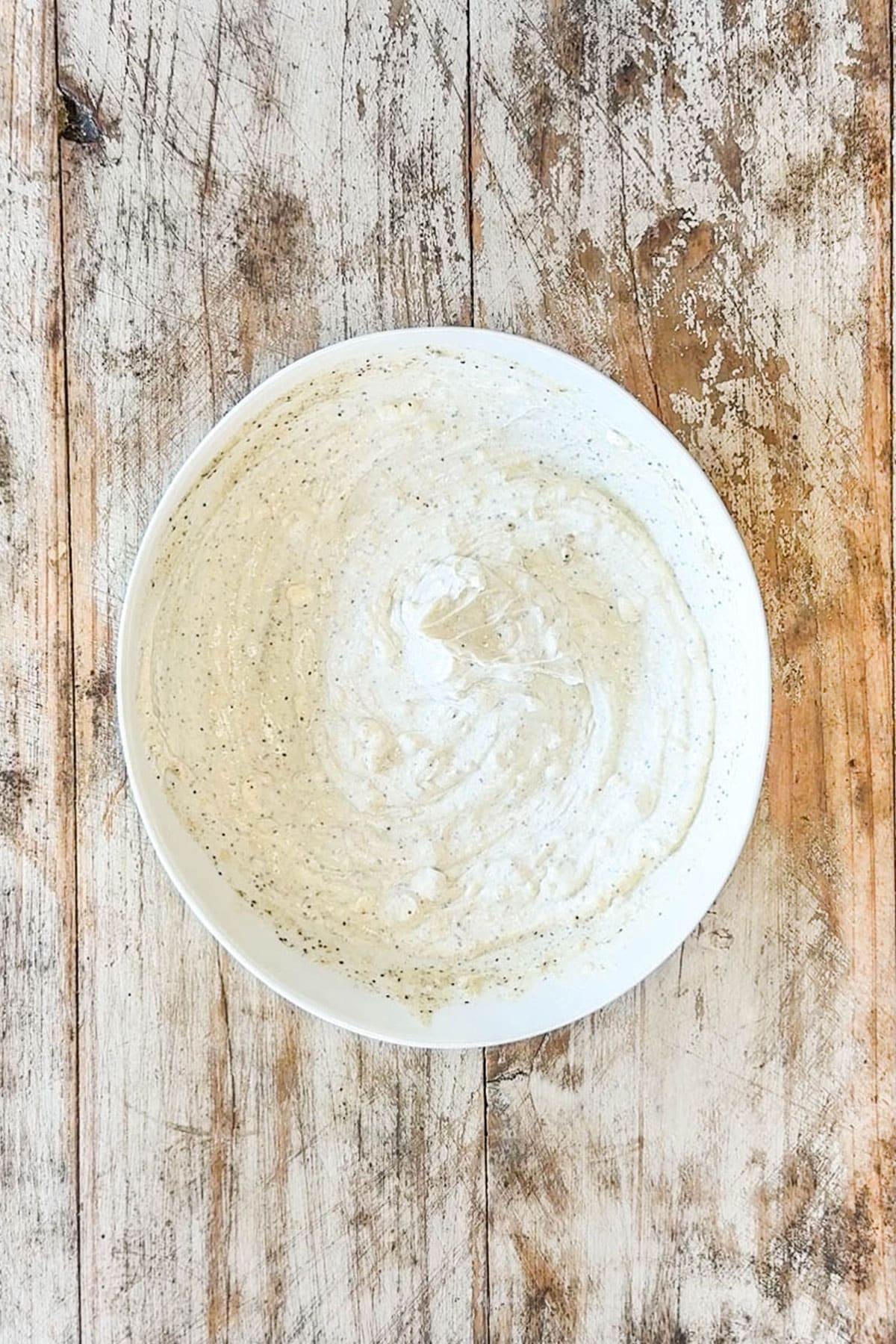 greek yogurt marine in white bowl on wooden background