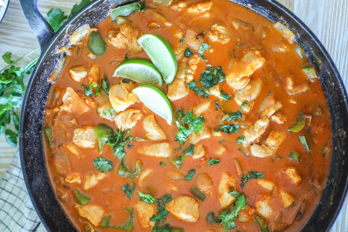 Overhead shot of one pan chicken curry in a skillet.