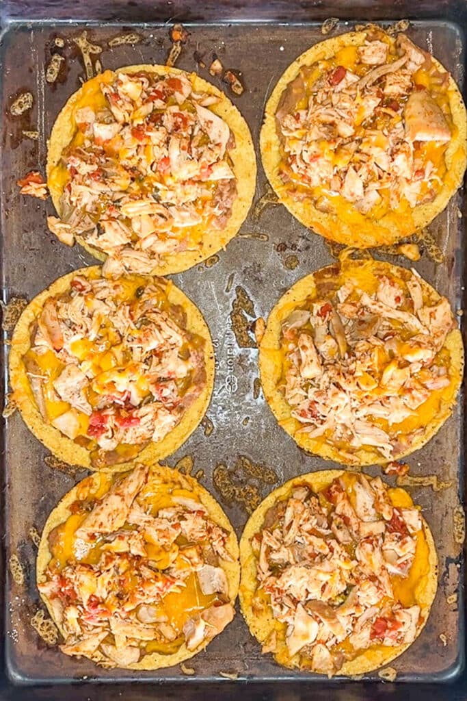 baked tostadas on a baking sheet.