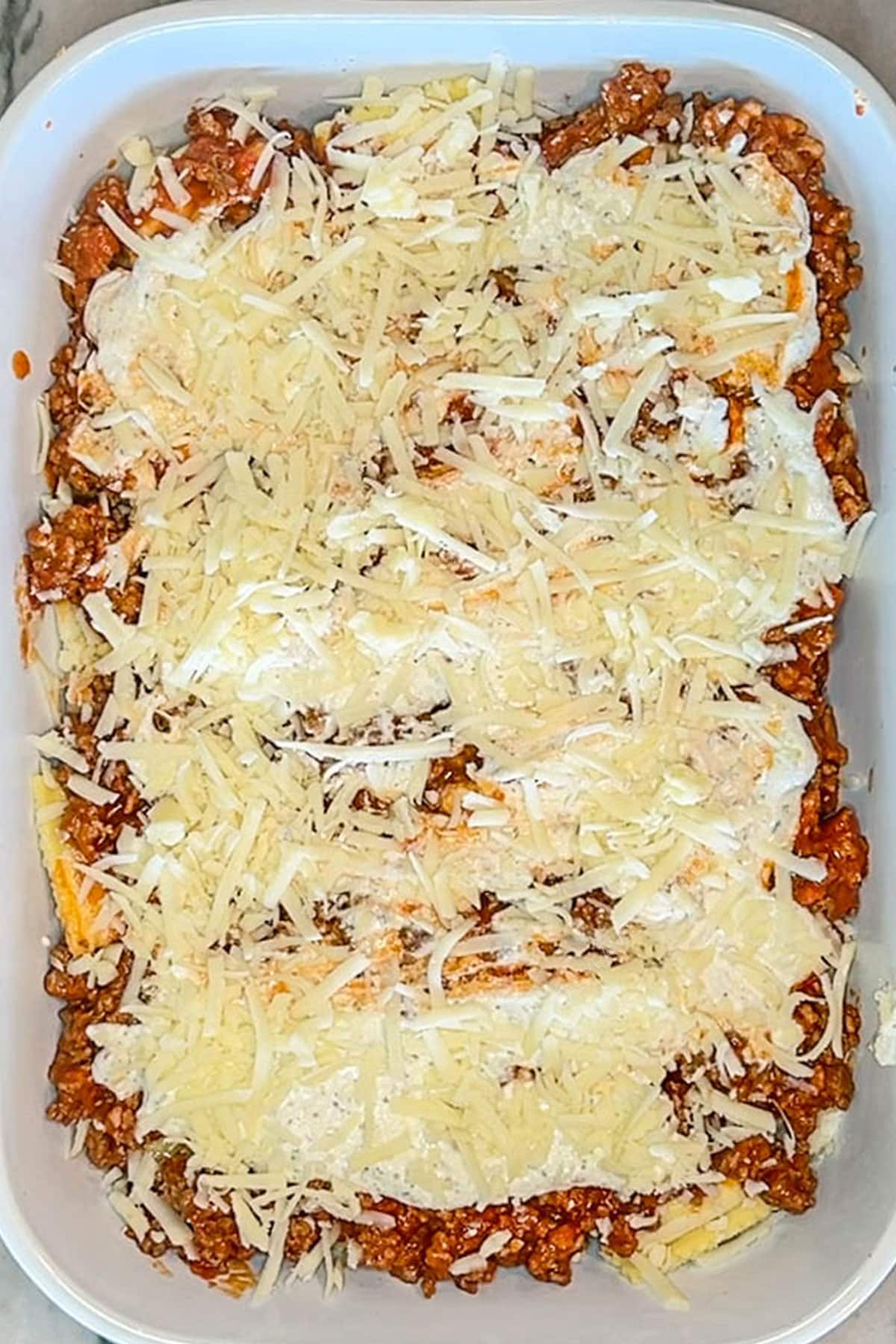 Overhead shot of million dollar ravioli assembled before baking.