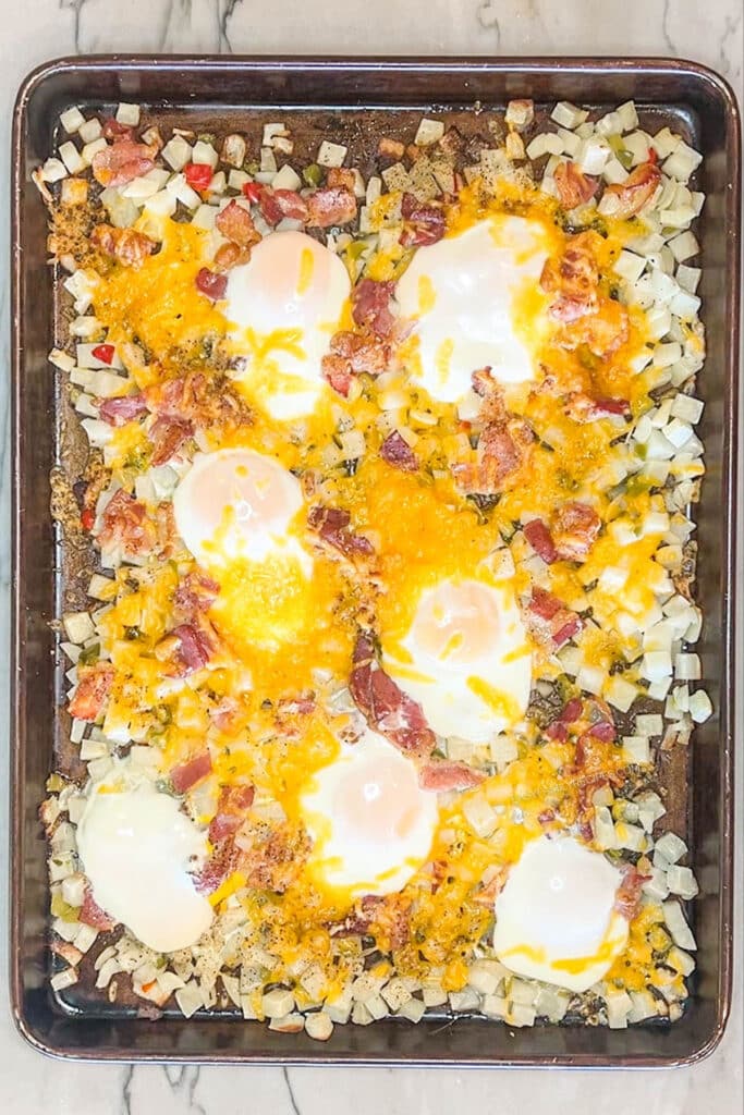 finished breakfast bake with hash browns in a baking dish.