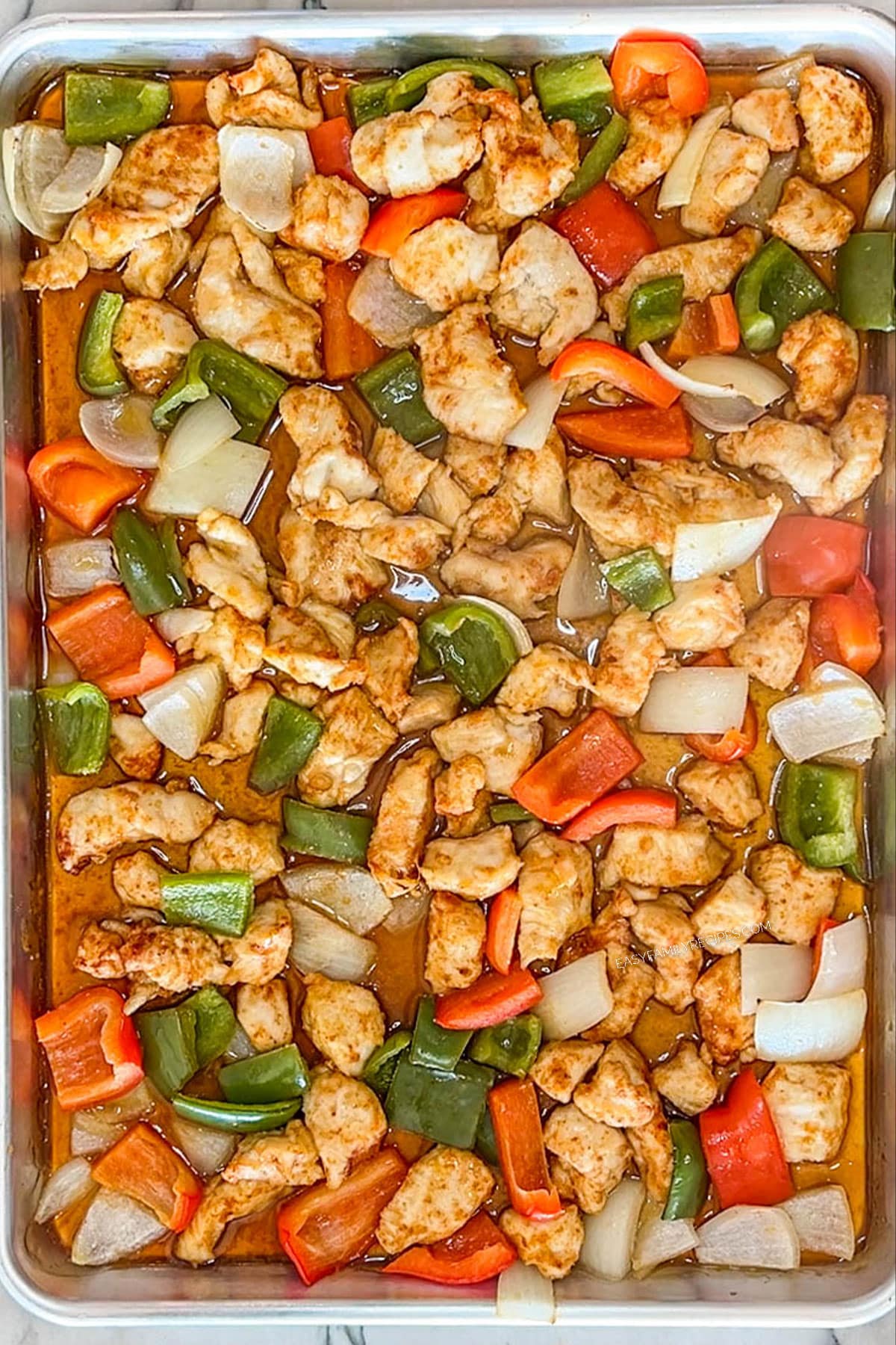 Pan of cooked sheet pan orange chicken