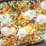 above image of sheet pan bacon egg breakfast has on a baking sheet.