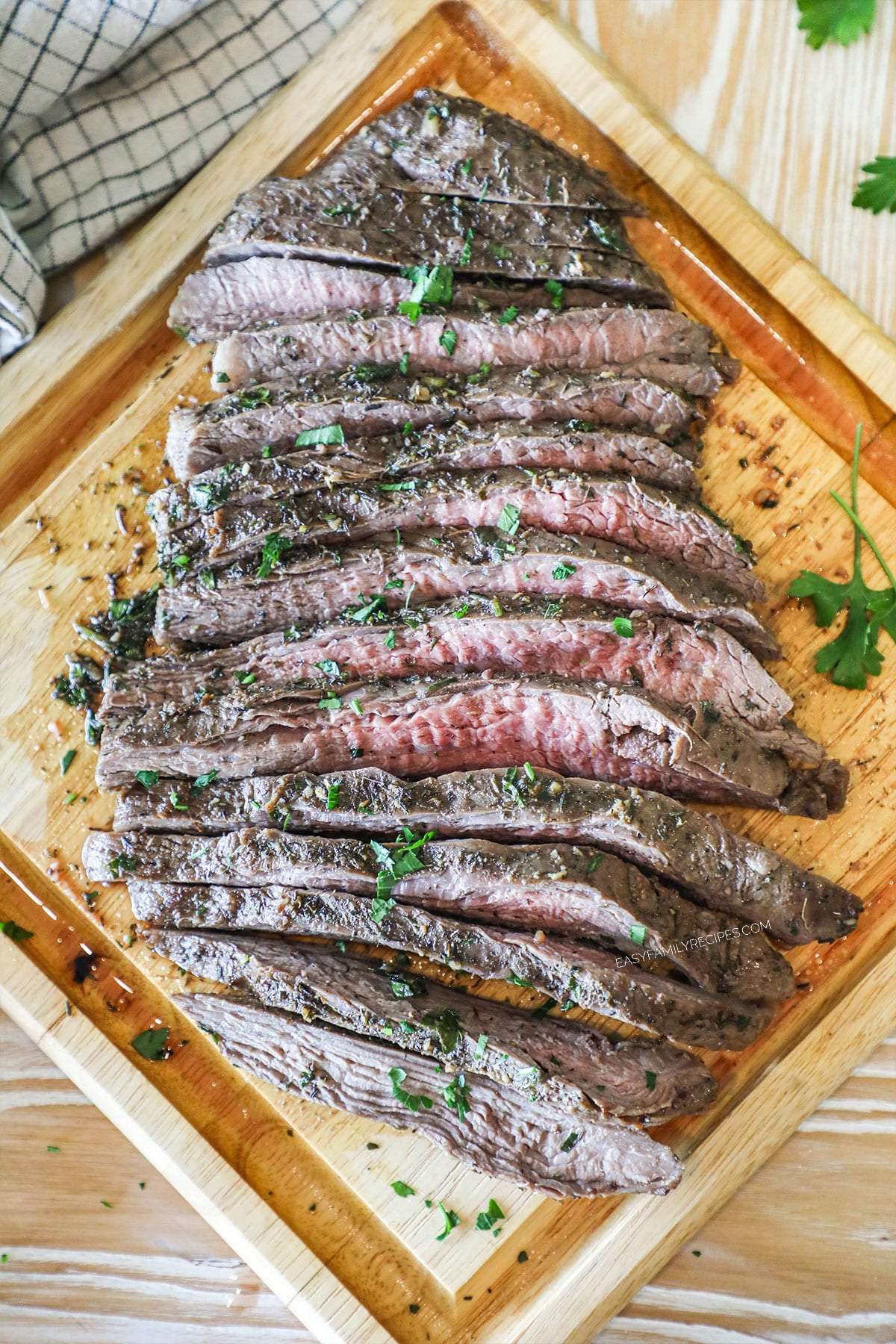 Flank steak cut on wooden board
