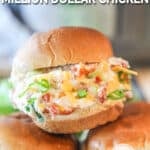 Crockpot Million Dollar Chicken stuffed into sliders- 3 slider sandwiches piled together