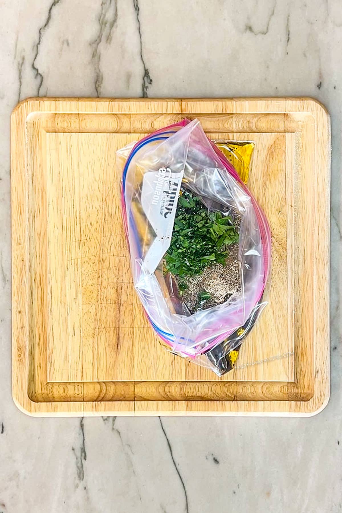 Step 1 for how to make flank steak marinade- add ingredients to bag