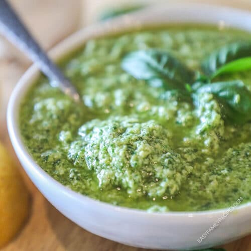 homemade pesto garnished with fresh basil in a bowl.