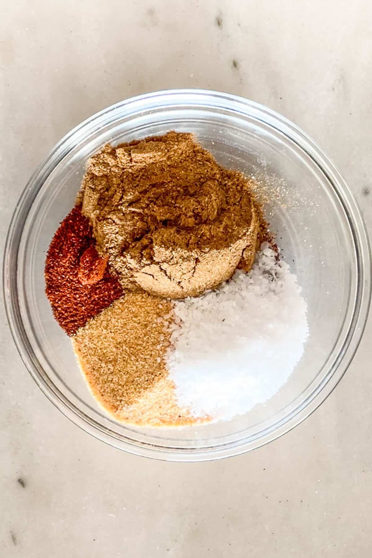 The various spices for Carne Asada Seasoning Blend in a clear bowl