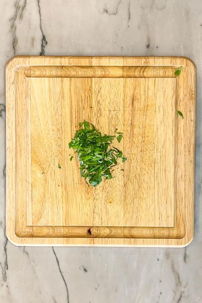 fresh herbs on a cutting board.