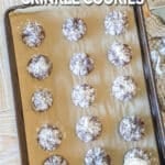 Baked Brownie Crinkle Cookies- on a parchment paper lined sheet pan