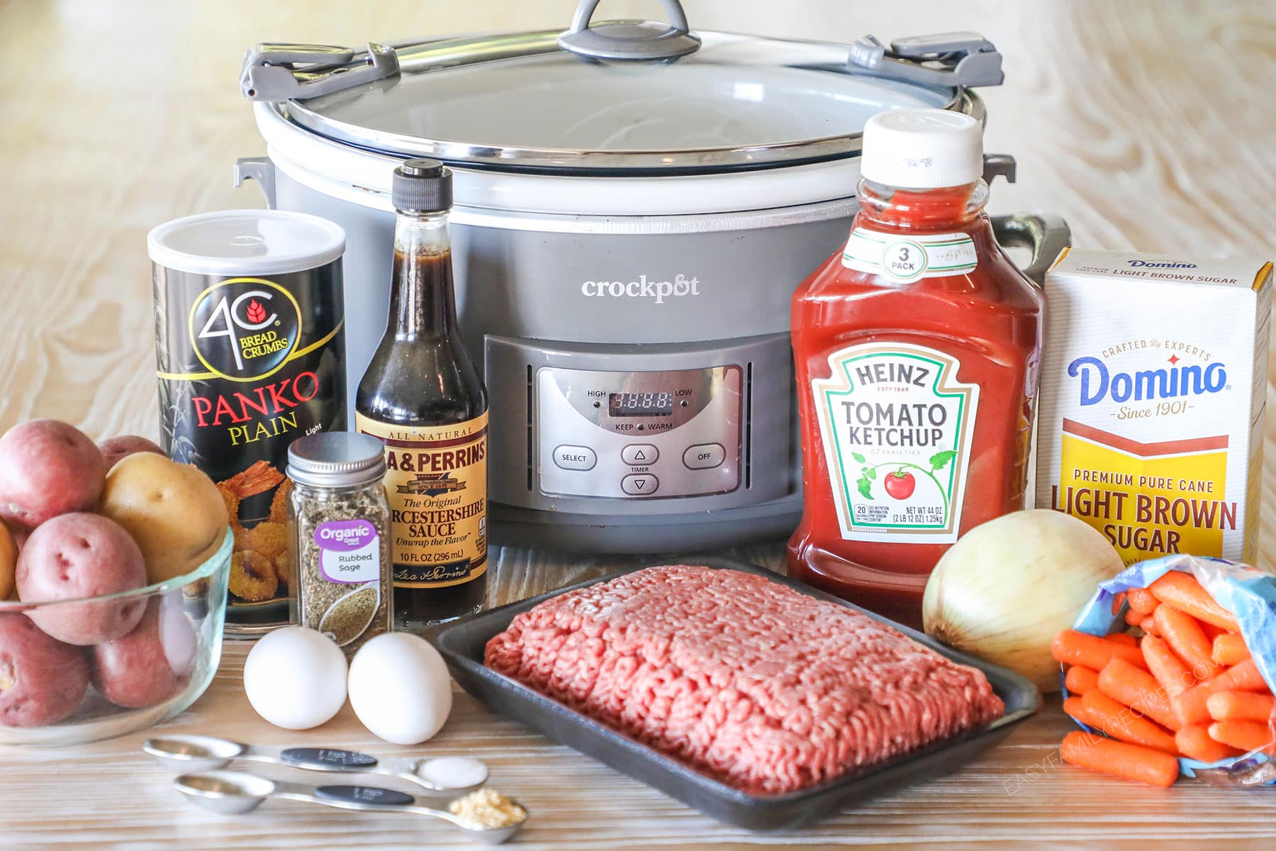 ingredients needed to make Crockpot Meatloaf and Potatoes- on a wooden background with a silver crockpot