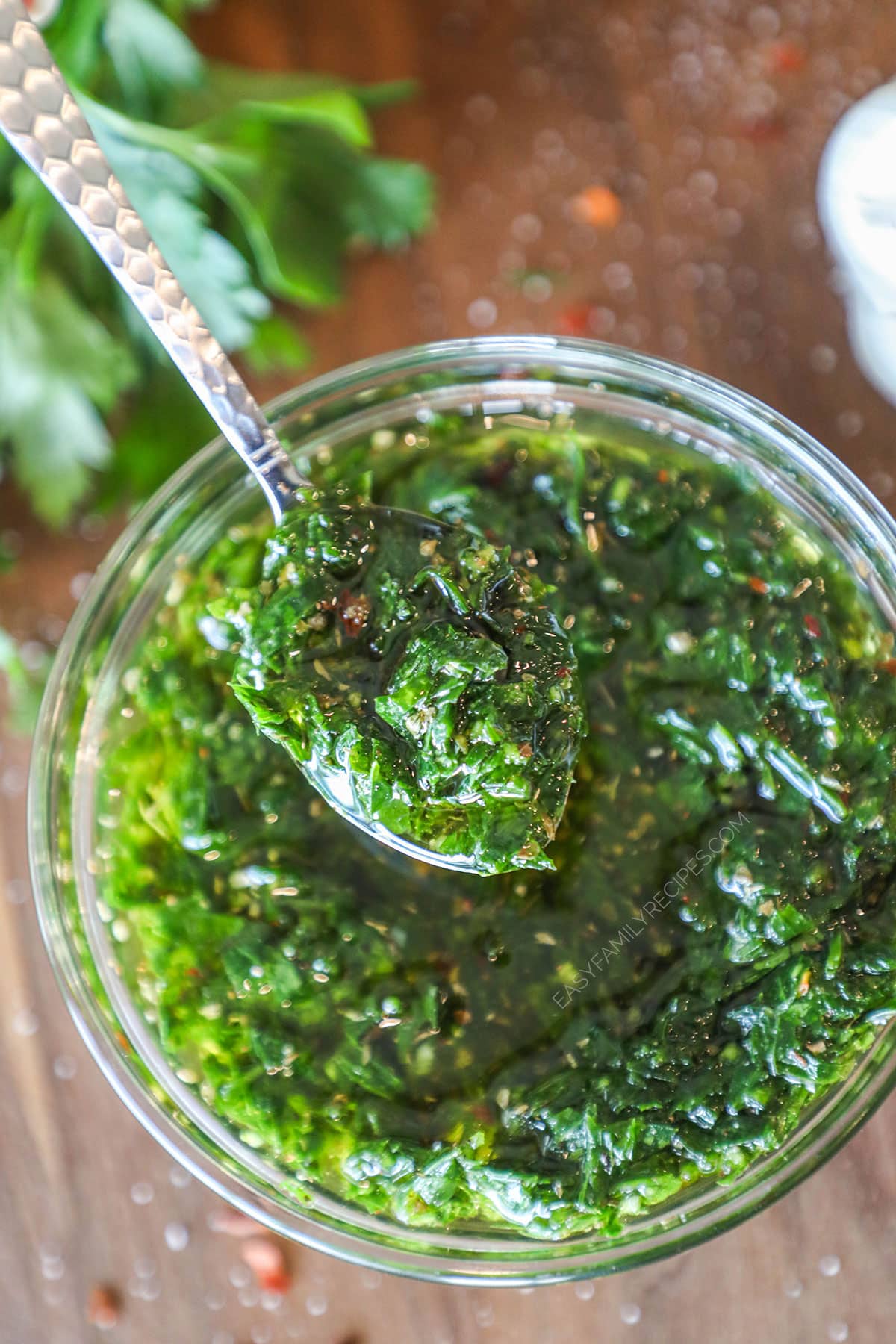 above image of a bowl of the best chimichurri recipe.