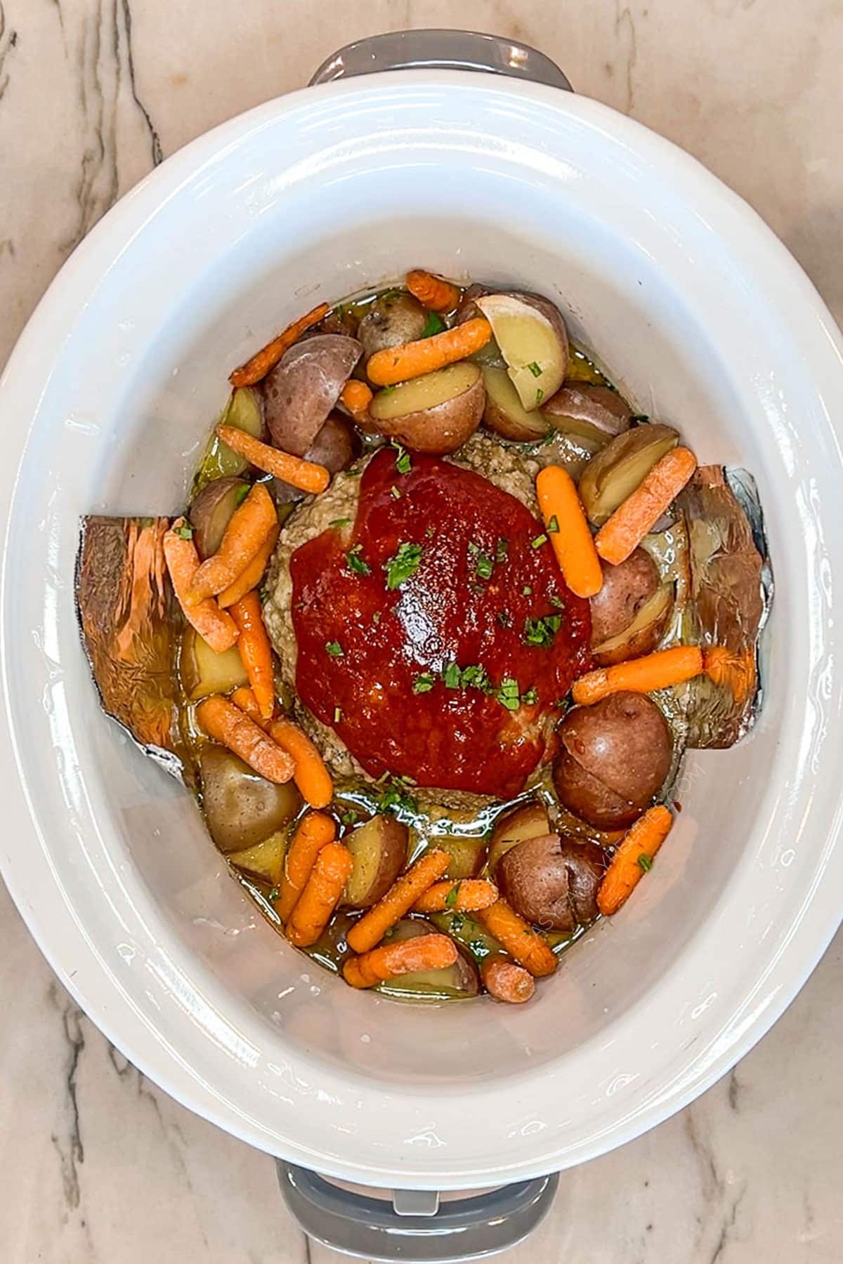 Step 4 for making Crockpot Meatloaf and Potatoes- completed meal in white crockpot