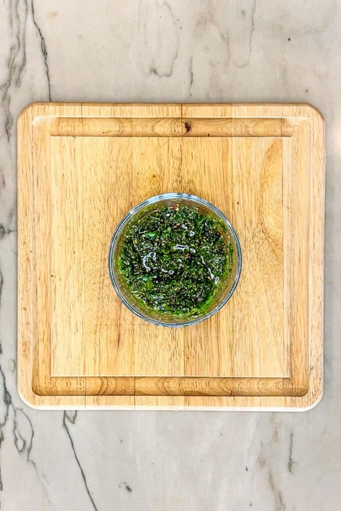 finished homemade chimichurri in a small mixing bowl.