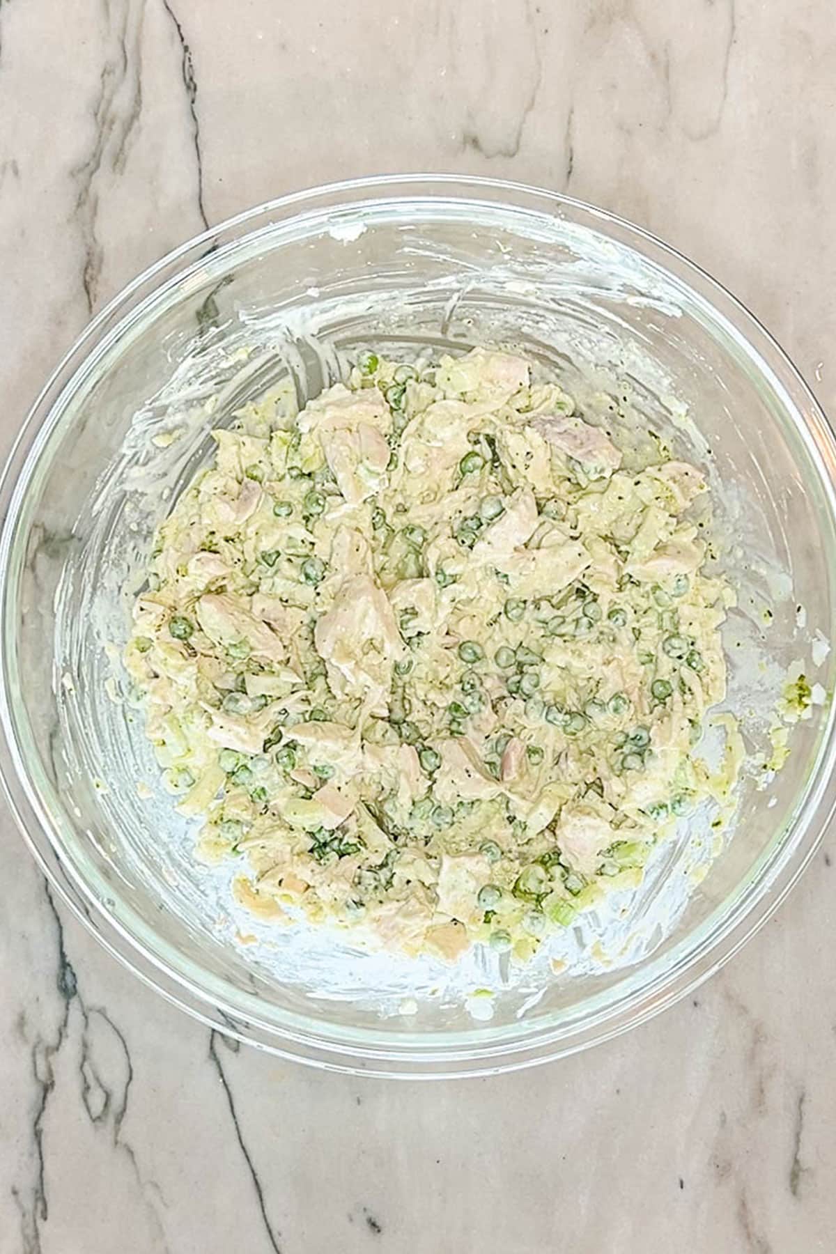 Step two for making pesto chicken salad- stir to combine ingredients together