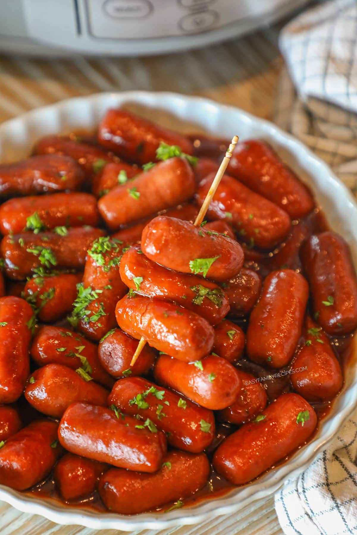 cocktail sausages on a toothpick in a bowl.