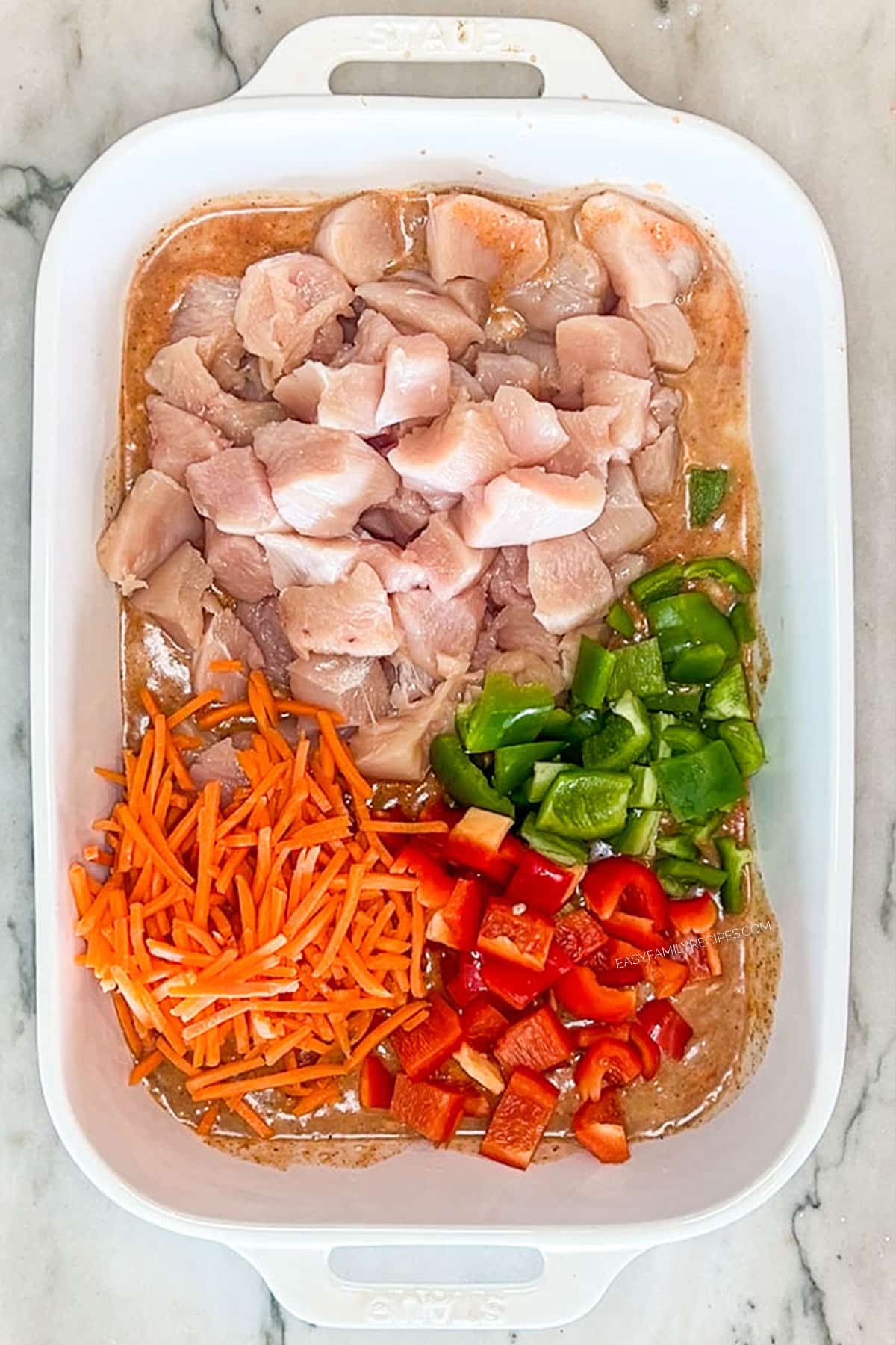 Carrots and bell peppers added to the chicken and curry sauce.