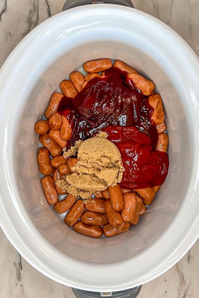 sauce ingredients and cocktail sausages in a slow cooker.