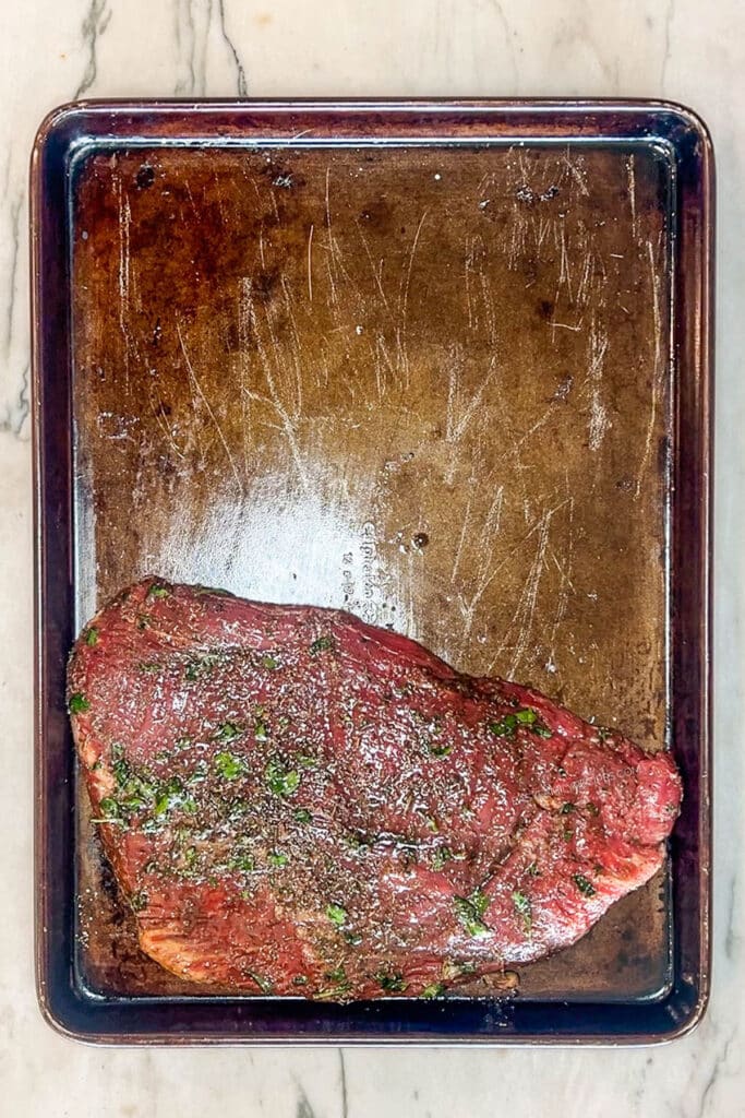 flank steak on a sheet pan.