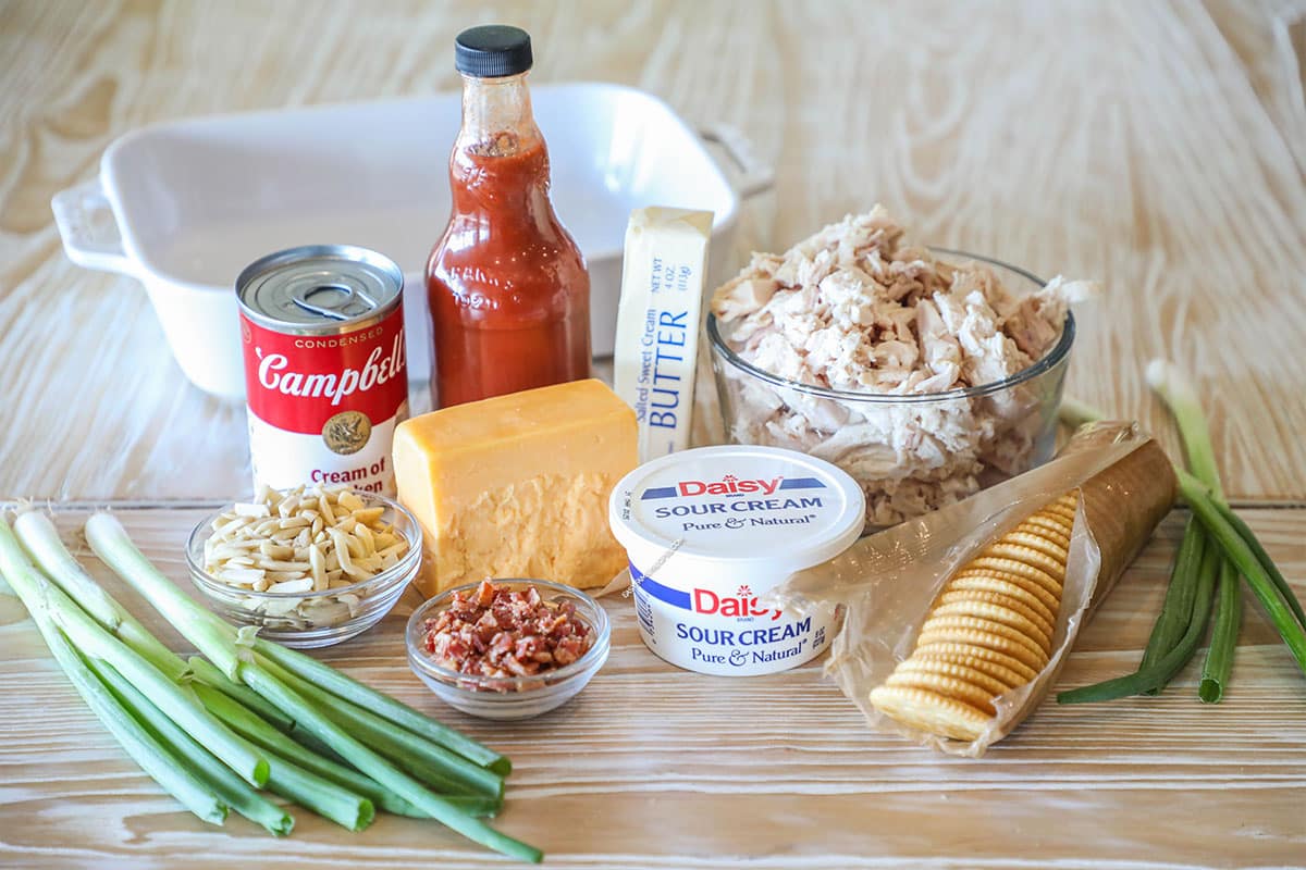 Ingredients needed to make Neiman Marcus Chicken Casserole- on a wooden background