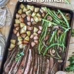 a sheet pan loaded with easy marinated flank steak, roasted mushrooms, green beans, and potatoes.