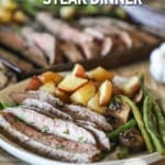flank steak and roasted veggies on a plate.