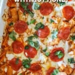 Finished pepperoni baked rigatoni drizzled with hot honey in a baking dish.
