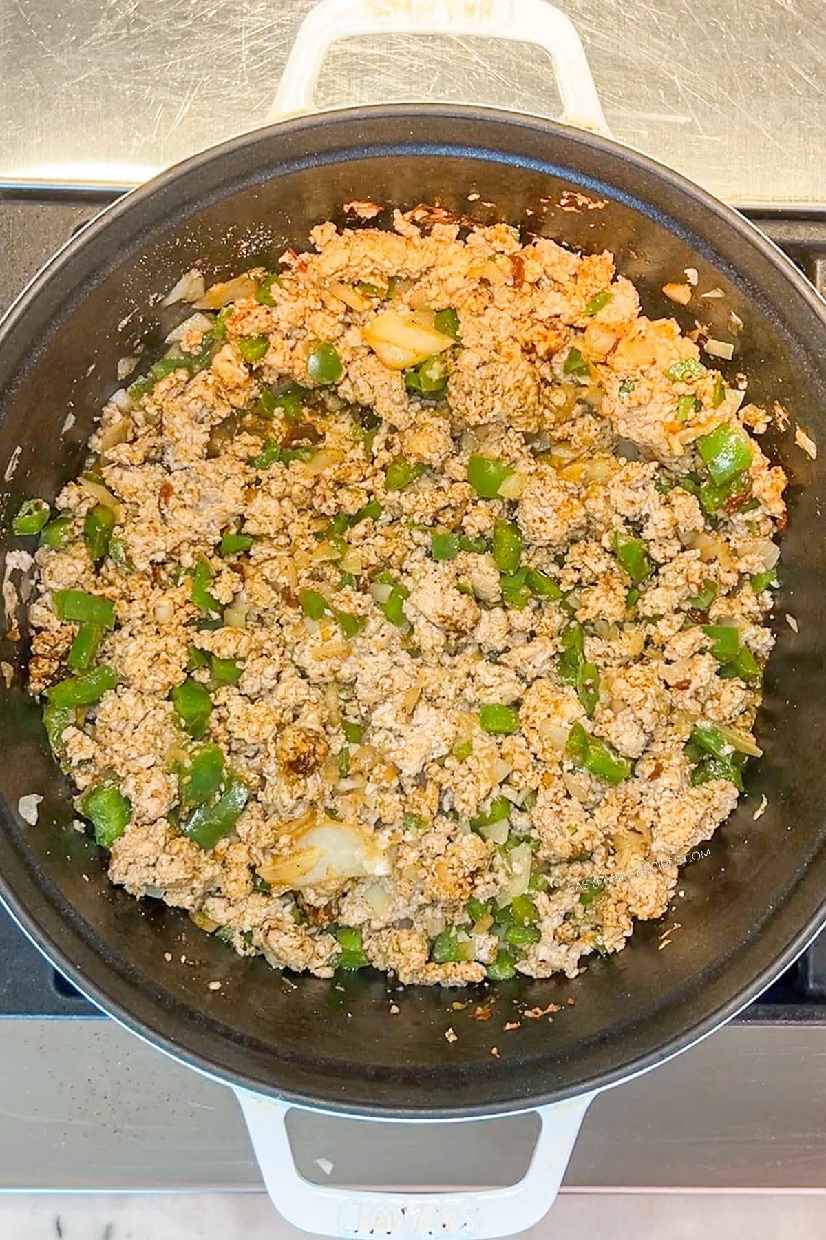 Step 3 for making Chipotle Black Bean Ground Turkey Chili- stir until everything is coated
