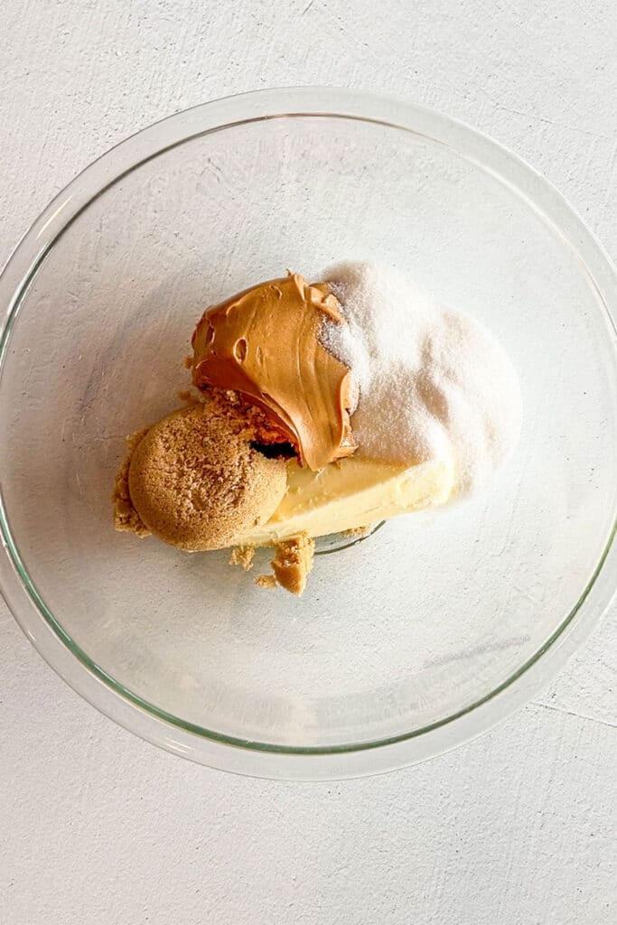 butter, sugar, and peanut butter in a mixing bowl.