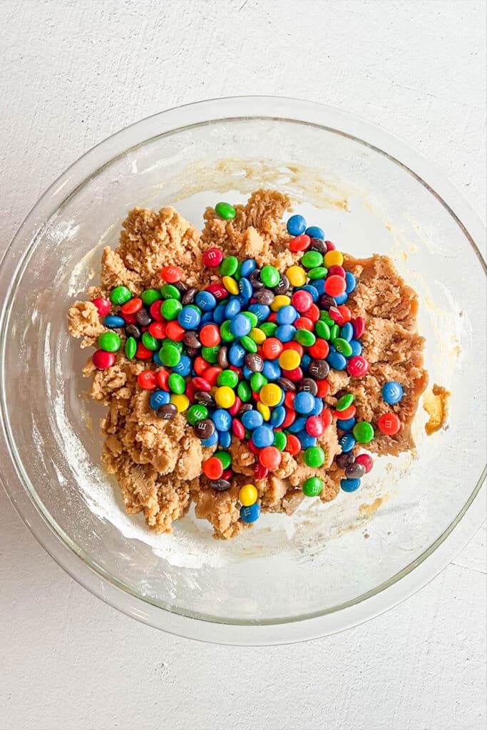 M&Ms added to peanut butter cookie dough.