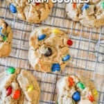 above image of finished peanut butter M&M cookies on a cooling rack.