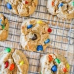 above image of finished peanut butter M&M cookies on a cooling rack.