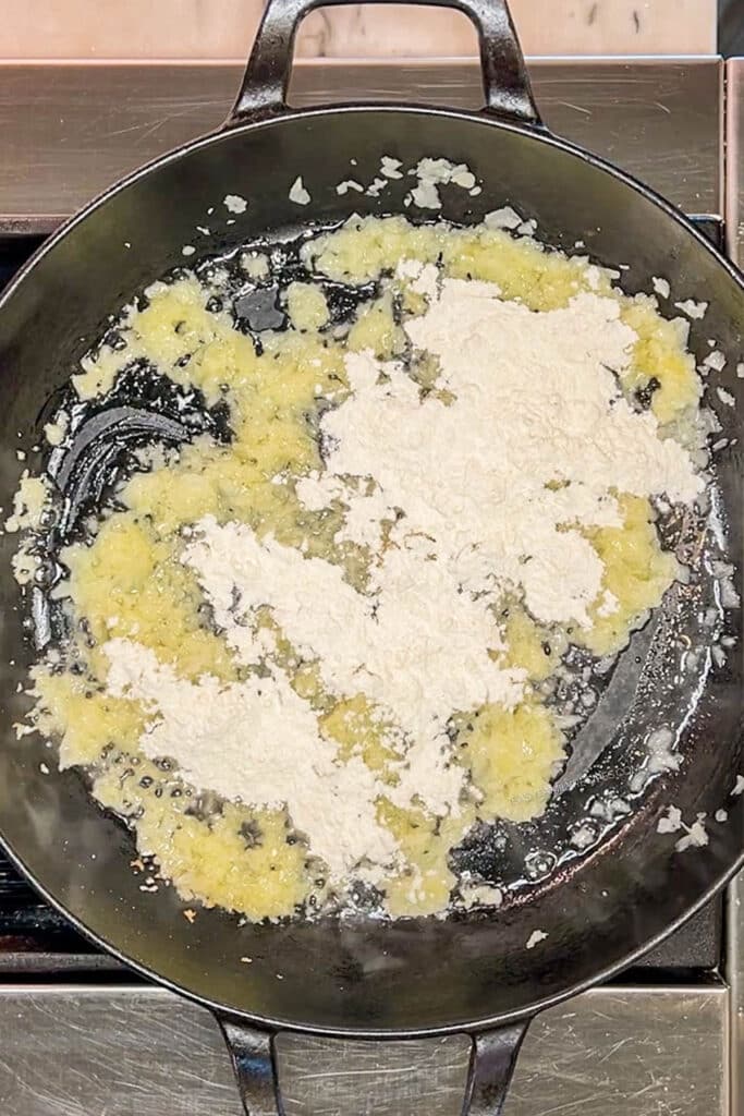 Flour added to onions and butter in skillet.