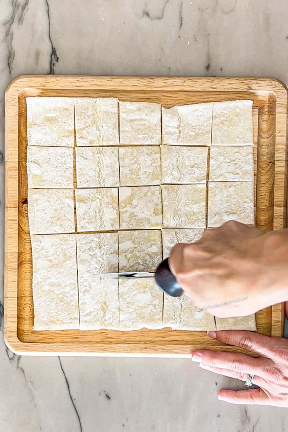 Step 1 for making Pear and Gorgonzola Puff Pastry Bites- cut puff pastry in 24 pieces
